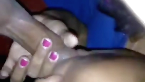 Indian brunette sucks and gives handjob on the bed