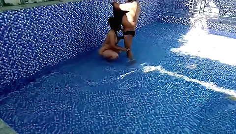 Swims with a dude in outdoor swimming pool with couple