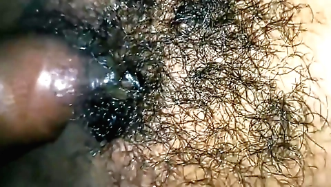 A really hairy indian girl is filmed in the bedroom