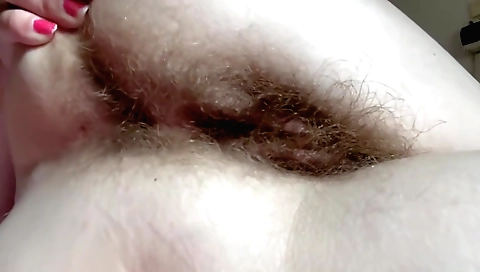 Hairy teen in sexy black bikini is making a solo video