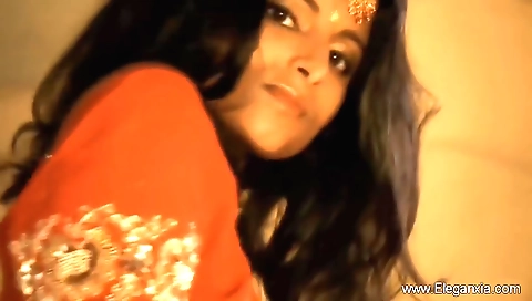 Indian brunette seduces you with her eyes and plays with your face