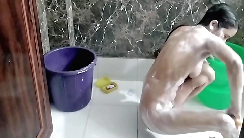Indian babe naked and masturbating in the bathroom