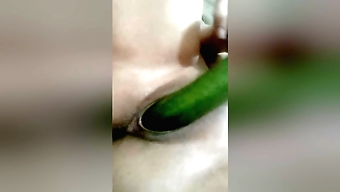 Indian girl is masturbating a giant dildo on the bed