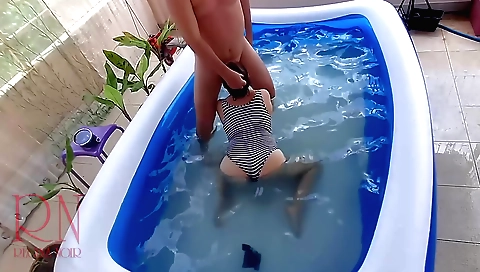 Pool girl with a small body masturbating in the pool