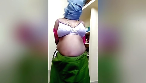 Indian chick shows off her boobs and booty in solo video