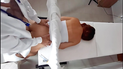 Redhead with small tits and a red ass getting her pussy fanned