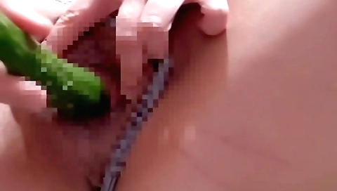 Cute amateur cucumber masturbation in a solo scene