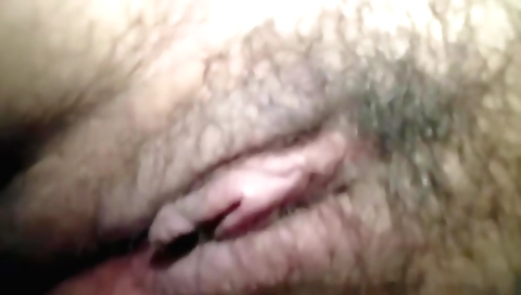Sexy solo female with a nice hairy pussy plays with it