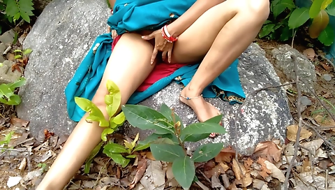 Indian woman with big natural boobs fucks outdoors